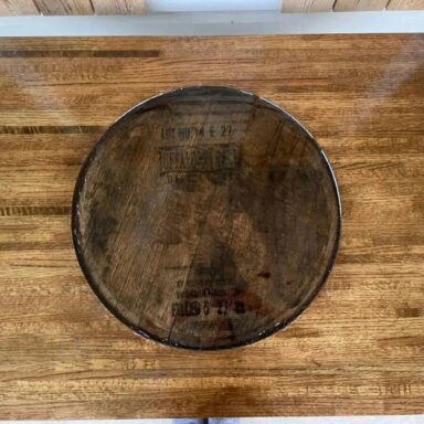 Solid Oak with distillery lid in center covered with epoxy