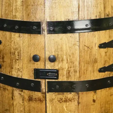 Close up of locking mechanism on whiskey barrel cabinet with doors