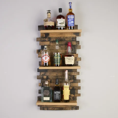 Large staggered stave shelf with 3 solid oak shelves with bottles of whiskey on each shelf