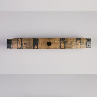 Empty bourbon barrel stave shelf with metal accents on either side.