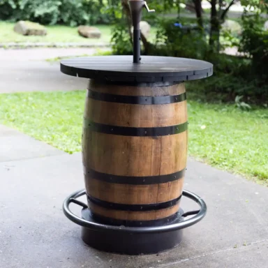 outdoor barrel table with metal footrest and umbrella