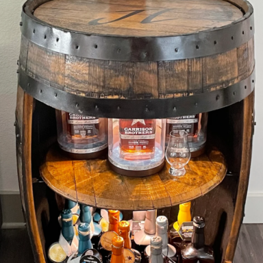 Whiskey barrel bar with barrel lid shelf and lights