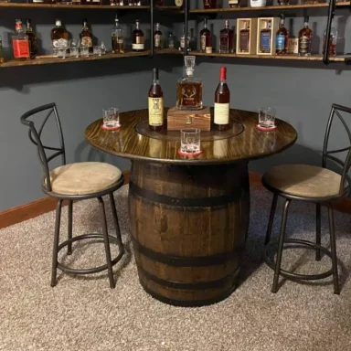 Whiskey barrel table with dark walnut stain. Liquor bottles sitting on table