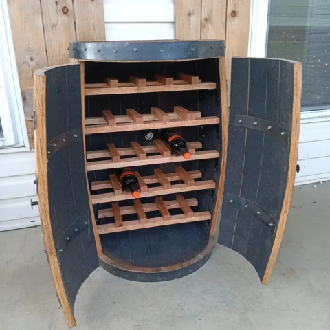 Wine barrel cabinet with a couple bottles on the racking system