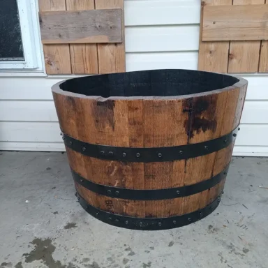 Wooden barrel planter with metal bands